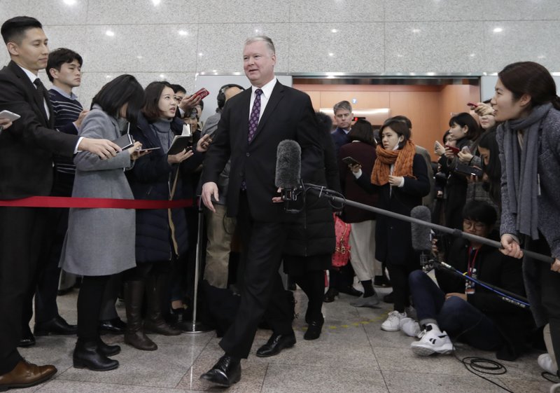 U.S. Special Representative for North Korea Stephen Biegun, center, leaves at Foreign Ministry in Seoul, South Korea, Friday, Dec. 21, 2018. The Trump administration's special envoy for North Korea on Friday expressed optimism about the diplomatic push to resolve the nuclear crisis, a day after the North issued a surprisingly blunt statement saying it will never disarm unless the U.S. removes what it calls a nuclear threat. (AP Photo/Lee Jin-man)