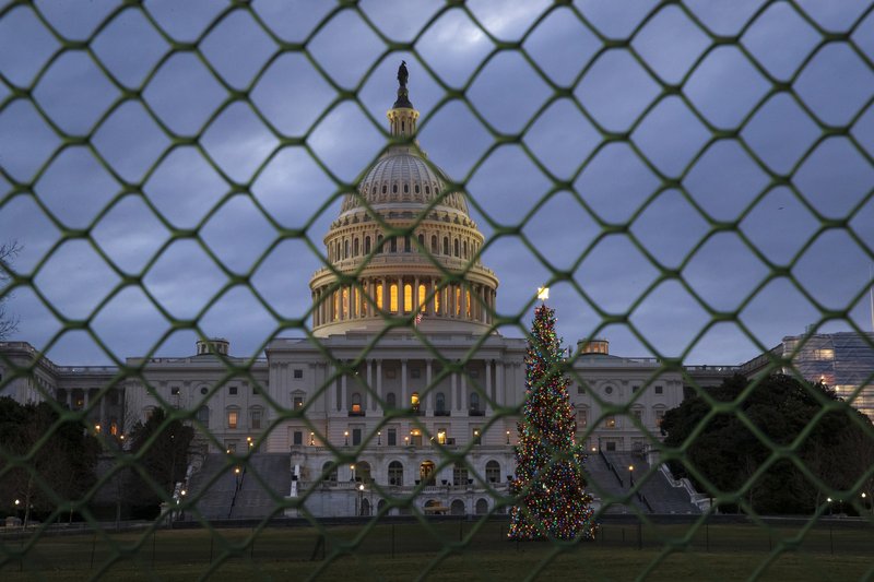 The Capitol is seen on the first morning of a partial government shutdown, as Democratic and Republican lawmakers are at a standoff with President Donald Trump on spending for his border wall, in Washington, Saturday, Dec. 22, 2018. Government operations will be disrupted during the shutdown and hundreds of thousands of federal workers will be furloughed or forced to work without pay just days before Christmas. (AP Photo/J. Scott Applewhite)

