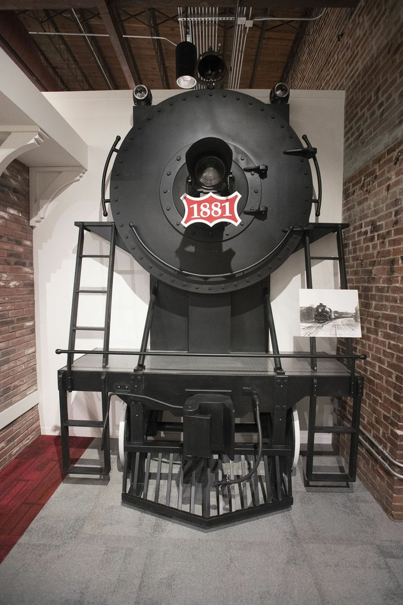 NWA Democrat-Gazette/J.T. WAMPLER A nose of a locomotive comes out of a wall at the newly revamped and reopened Rogers Historical Museum.