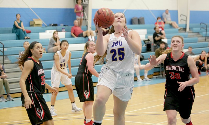 Photo submitted John Brown senior Preslea Lawson drives to the basket Tuesday against Benedictine (Kan.) in the Malika Sport Tours Hoop N Surf Classic in Honolulu, Hawaii. Benedictine defeated JBU 58-56 in overtime.