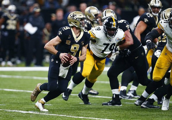 Saints manage late TD, secure NFC's top seed