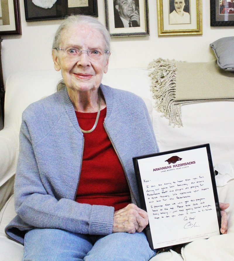 Razorbacks: Kathleen Smith, a Razorback fan at Hudson Senior Center, holds up the letter that Chad Morris, Arkansas’ head football coach, wrote her after she fell while watching the Oct. 13 game.