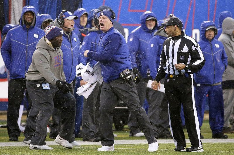 New York Giants head Coach Pat Shurmur (center) said Monday that the Giants will be going all out to beat the Dallas Cowboys on Sunday in a game that doesn’t have any playoff implications for either team.