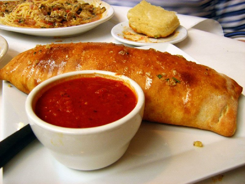 A stromboli at Roma Italian Restaurant in Jacksonville is filled with pepperoni, sausage, mushrooms and cheese and served with a side of marinara sauce. 