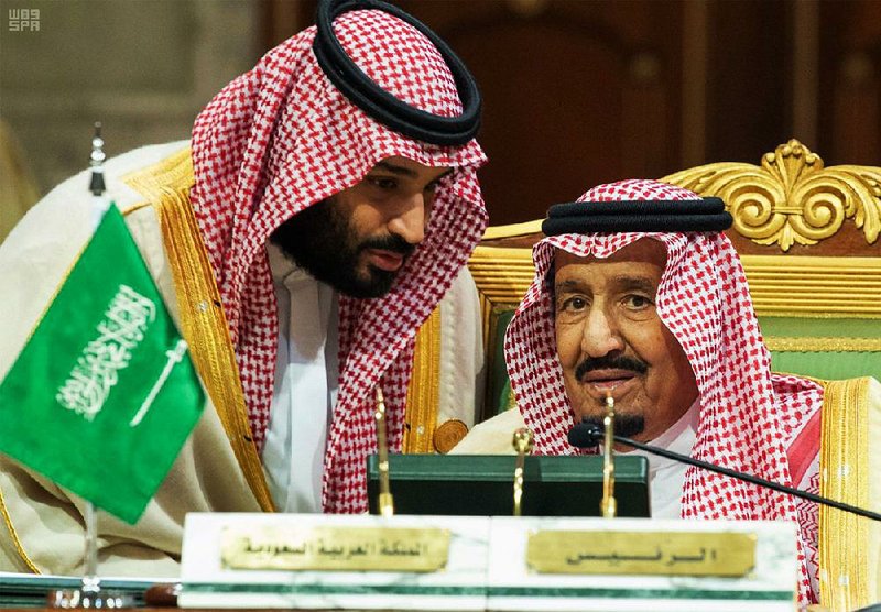 Saudi Crown Prince Mohammed bin Salman (left) and his father, King Salman, confer during a meeting in early December of the Gulf Cooperation Council in Riyadh, Saudi Arabia. King Salman restructured the kingdom’s Cabinet on Thursday with new ministers and security chiefs, but the crown prince retained his near-total control over the government despite heavy international scrutiny  over the death of Saudi journalist Jamal Khashoggi in Turkey. 