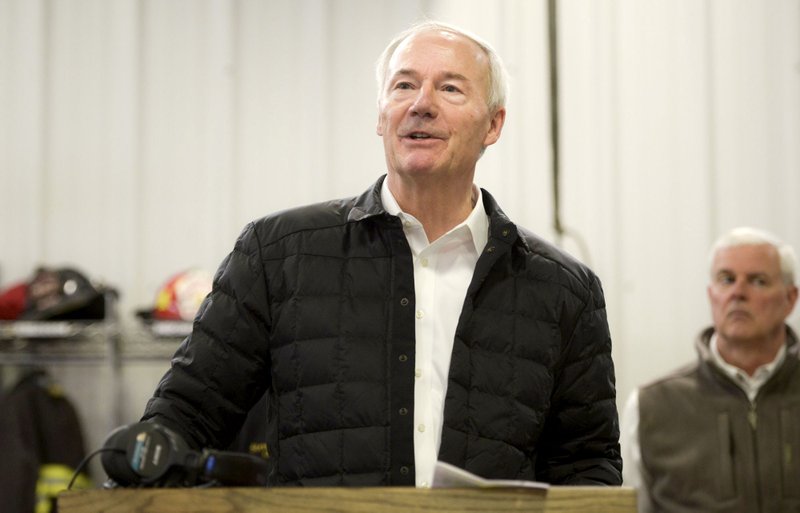 NWA Democrat-Gazette/CHARLIE KAIJO Gov. Asa Hutchinson speaks during a press conference, December 28, 2018 at the Bella Vista Fire Department in Bella Vista. Gov. Asa Hutchinson held a news conference at the Fire Department to declare the stump dump fire on Trafalgar Road an emergency. 