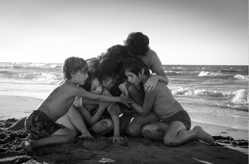 A scene in Alfonso Cuaron’s Roma features Marco Graf (from left), Daniela Demesa, Yalitza Aparicio, Marina de Tavira, Diego Cortina Autrey and Carlos Peralta.