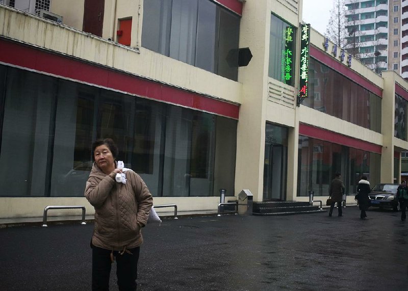 A pedestrian passes one of the “Singapore shop” outlets in Pyongyang, North Korea, that sell products that are banned under sanctions imposed by the United Nations and the United States. 