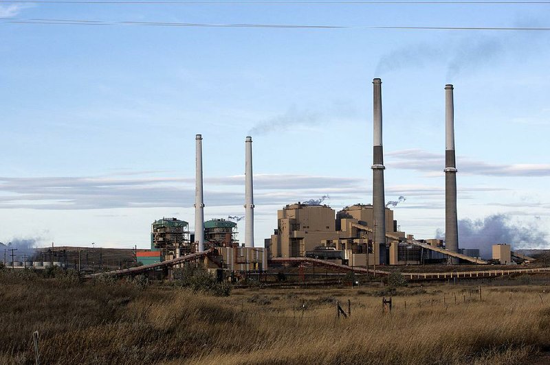 A coal-burning power plant operates in October in Colstrip, Mont. Under a proposal made public Friday by the Environmental Protection Agency, restrictions and penalties on mercury emissions by coal-burning plants would be removed. The EPA said current rules are too costly to justify. 