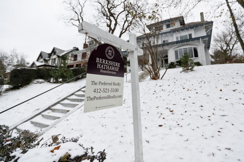 A realtor sign hangs in front of a home for sale in Pittsburgh on Wednesday, Nov. 28, 2017. Fewer Americans signed contracts to buy homes in November as higher mortgage rates and prices squeezed would-be buyers out of the market, especially in the West.(AP Photo/Keith Srakocic)
