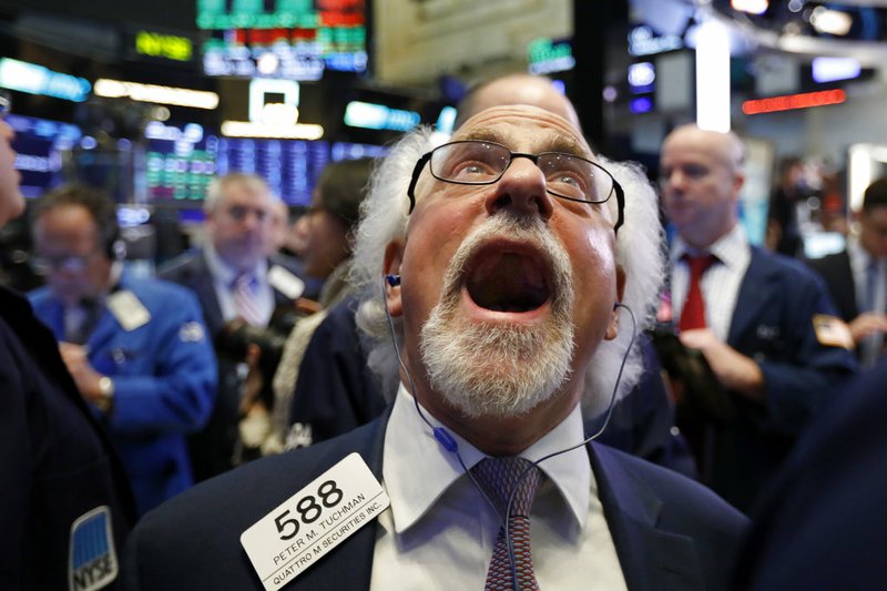 Trader Peter Tuchman works on the floor of the New York Stock Exchange, Friday, Dec. 28, 2018. Stocks are opening higher Friday as U.S. markets try to maintain the momentum from a late-day rally on Thursday. (AP Photo/Richard Drew)