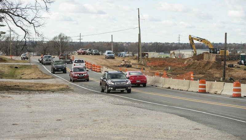 NWA Democrat-Gazette/BEN GOFF  @NWABENGOFF Cars pass by road construction Thursday on Arkansas 265/Old Wire Road near the intersection with East Randall Wobbe Lane in Springdale.