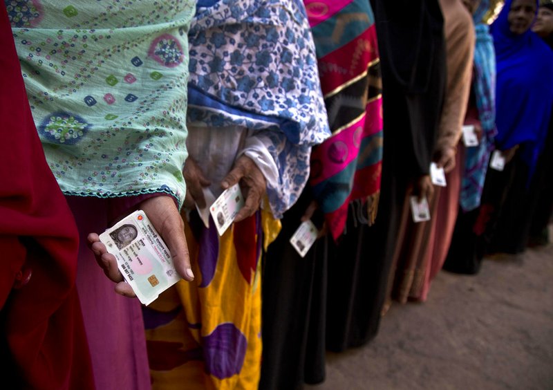 Bangladeshi women line up outside a polling station to cast their votes in Dhaka, Bangladesh, Sunday, Dec. 30, 2018. Voting began Sunday in Bangladesh's contentious parliamentary elections, seen as a referendum on what critics call Prime Minister Sheikh Hasina's increasingly authoritarian rule. 