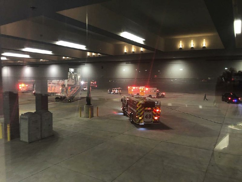 Emergency personnel respond Saturday after an “equipment failure” involving a jet bridge at Baltimore/Washington International Thurgood Marshall Airport in Baltimore.