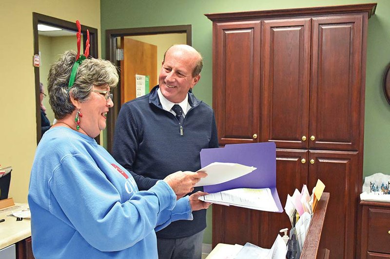 Deputy Court Clerk Shelia Butler shares a laugh with Horseshoe Bend Mayor-elect Craig Huckaby at the Horseshoe Bend City Hall before the holidays.