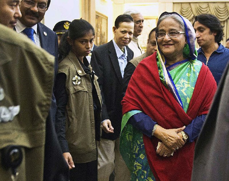 Bangladeshi Prime Minister Sheikh Hasina leaves after meeting with journalists Monday in Dhaka, Bangladesh. Hasina, whose ruling alliance won 288 of 300 seats in Sunday’s parliamentary elections, dismissed the political opposition and its leaders’ concerns about whether the vote was fair.