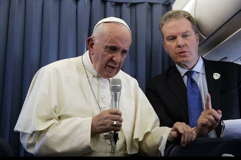 The Vatican spokesman, Greg Burke (right), is shown with Pope Francis in August. Burke and his deputy resigned suddenly Monday amid an overhaul of the Vatican’s communications operations that coincides with a troubled period in Pope Francis’ papacy.