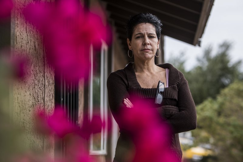 Michaela Christian, shown outside of her current home in Lake Havasu City, Ariz., was forced by Wells Fargo to sell her Las Vegas home or lose it to foreclosure in 2013. MUST CREDIT: Photo for The Washington Post by Joe Buglewicz