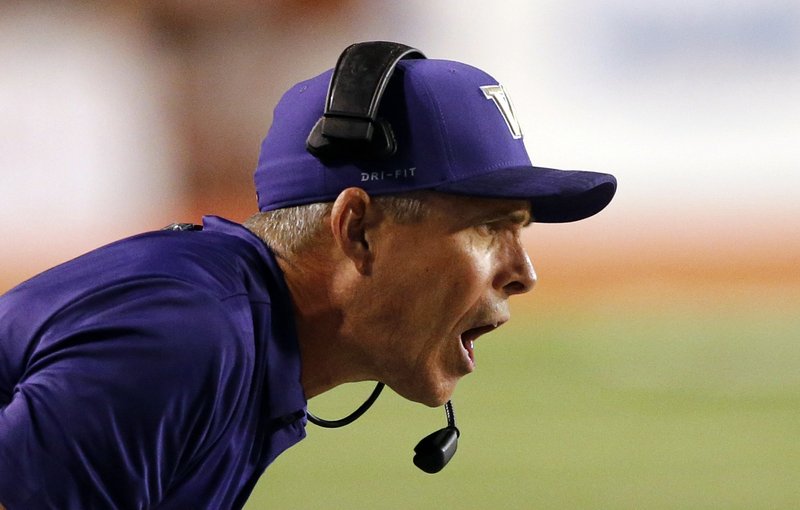 FILE - In this Sept. 15, 2018 file photo, Washington head coach Chris Petersen shouts to his team in the second half during an NCAA college football game against Utah, in Salt Lake City. Washington faces Ohio State in the Rose Bowl on Tuesday, Jan. 1, 2019. (AP Photo/Rick Bowmer, File)