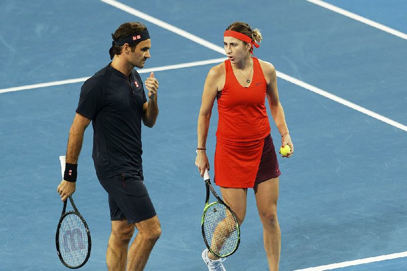 Roger Federer and his partner, Belinda Bencic (right), defeated Serena Williams and her partner, Frances Tiafoe, at the Hopman Cup in Australia on Tuesday. 