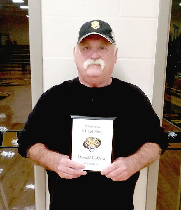 MARK HUMPHREY ENTERPRISE-LEADER Don Ledford was inducted into the Prairie Grove Athletic Hall of Pride on Friday, Dec. 7, 2018. He lettered in three sports, maintained membership in the Athletic Booster Club from 1986-2001, and continues to volunteer coaching kids in basketball. His daughter, Shelley Dougan is head junior high girls basketball coach and assistant varsity coach.