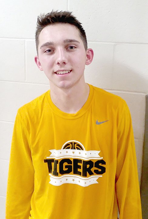 MARK HUMPHREY ENTERPRISE-LEADER Prairie Grove senior guard Riley Rhodes delivered an early Christmas gift to Tiger basketball fans by making the game-winning 3-point shot with the clock running out in a 46-43 win over West Fork on Friday, Dec. 7, 2018.