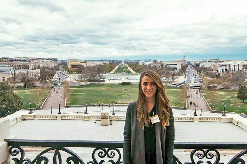 Photo submitted Samantha Tafoya, of Siloam Springs, stood on Congressman Steve Womack's (R-Ark.) balcony in the U.S. Capitol Building in April 2018. At the time, she was visiting Washington, D.C., with the College of Engineering at the University of Arkansas. The group of students were finalists for George Washington University's Planet Forward video contest. Currently, Tafoya is living and working in Washington, D.C., for Search for Common Ground, an international non governmental organization. She recently received the 2019 Thomas R. Pickering Foreign Affairs Fellowship, funded by the U.S. Department of State. The fellowship will allow Tafoya to earn her graduate degree and pursue a career in U.S. Foreign Service.