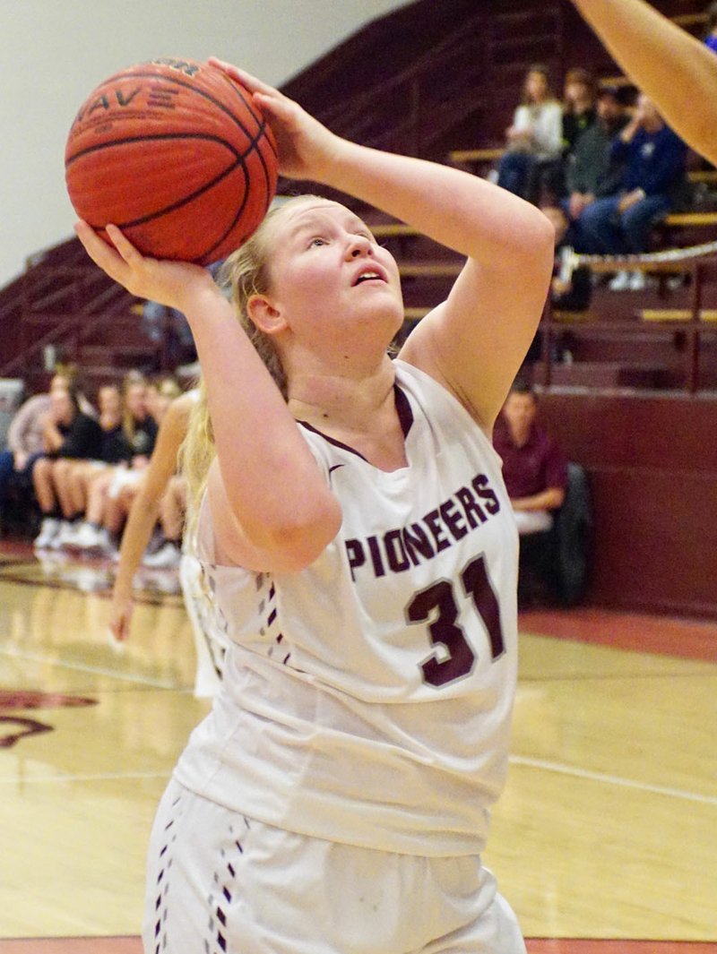 Westside Eagle Observer file photo/RANDY MOLL Gentry's Emily Toland, a sophomore, looks to shoot under the basket during the Dec. 18 game between Gentry and Gravette at Gentry High School.