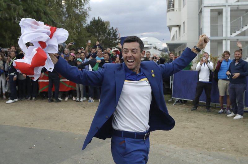 In this Sept. 30, 2018 file photo, Europe's Rory McIlroy celebrates after Europe won the Ryder Cup on the final day of the 42nd Ryder Cup at Le Golf National in Saint-Quentin-en-Yvelines, outside Paris, France. McIlroy is playing in Hawaii to start the year as he concentrates more on the U.S. tour.  