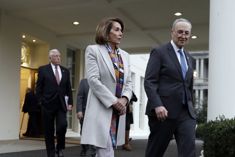 House Democratic leader Rep. Nancy Pelosi of California, and Senate Minority Leader Chuck Schumer, D-N.Y., walk to speak with reporters after a meeting with President Donald Trump on border security at the White House, Wednesday, Jan. 2, 2019, in Washington. (AP Photo/Evan Vucci)

