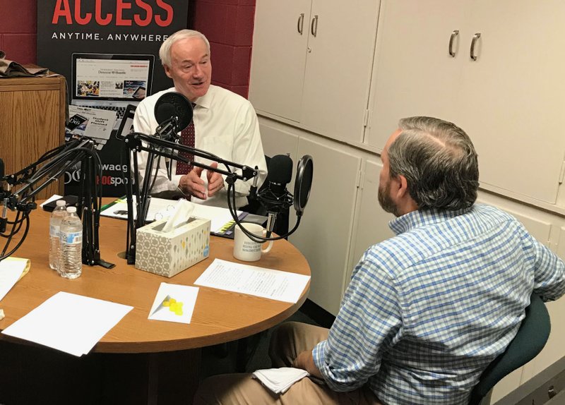 Gov. Asa Hutchinson talks with Greg Harton, editorial page editor, during the inaugural Speaking of Arkansas podcast.