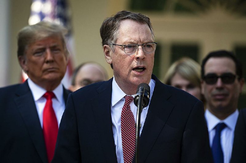 Robert Lighthizer, the U.S. trade representative, speaks beside President Donald Trump at a news conference about the U.S.-Mexico-Canada Agreement in the Rose Garden of the White House in Washington, Oct. 1, 2018. Lighthizer, a China skeptic, wants to prevent an anxious president from making a quick, empty deal in a rush to calm the markets. 