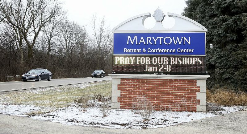 A sign at the Mundelein Seminary in Mundelein, Ill., greets Roman Catholic bishops Wednesday as they gathered for a retreat that follows blistering reports in Illinois and Pennsylvania over the church leaders’ response to sexual abuse cases. 