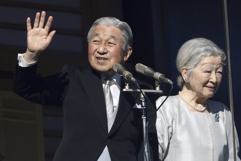 Japan's Emperor Akihito and Empress Michiko greet to well-wishers from the bullet-proofed balcony during his New Year's public appearance with his family members at Imperial Palace in Tokyo Wednesday, Jan. 2, 2019. 