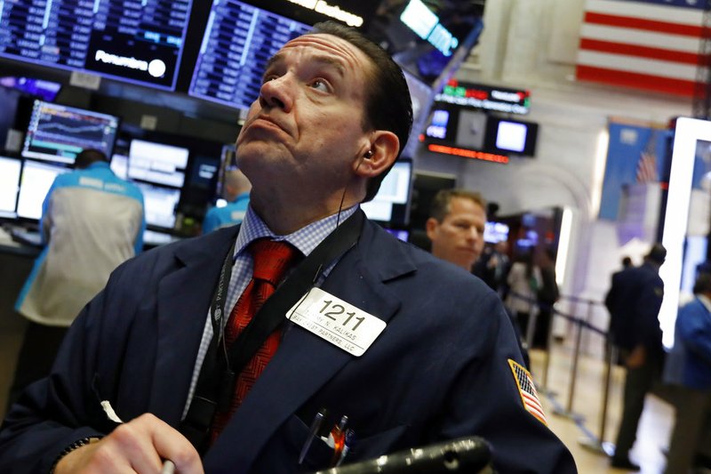 Trader Tommy Kalikas works on the floor of the New York Stock Exchange, Thursday, Jan. 3, 2019. Apple's shock warning that its Chinese sales are weakening ratcheted up concerns about the world's second largest economy and weighed heavily on global stock markets as well as the dollar on Thursday. (AP Photo/Richard Drew)