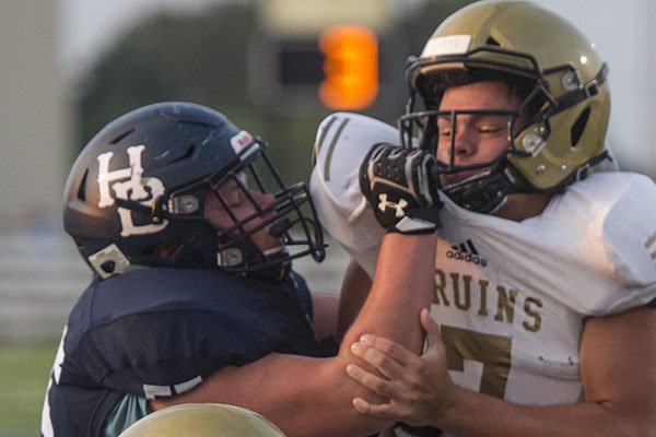 Jack Struebing (left) of Har-Ber blocks a Pulaski Academy defender during a game Friday, Aug. 24, 2018, in Springdale. Jack Struebing (left) of Har-Ber blocks a Pulaski Academy defender during a game Friday, Aug. 24, 2018, in Springdale.