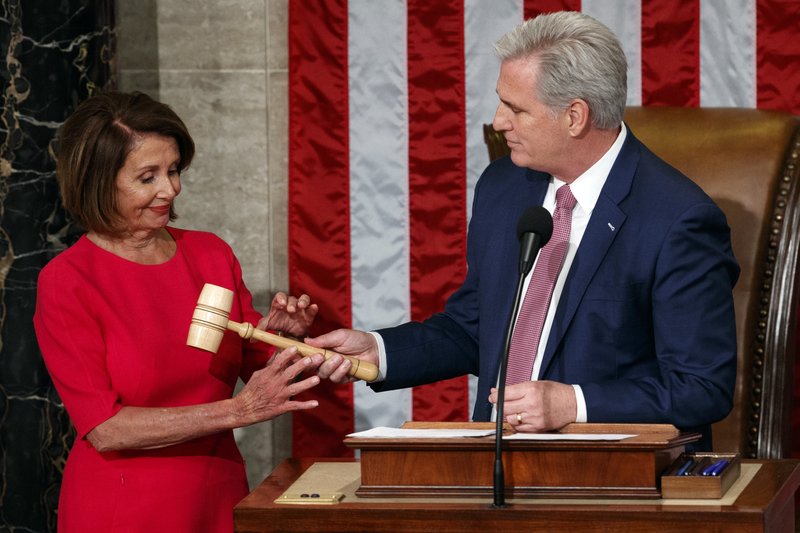 Nancy Pelosi of California takes the gavel from House Minority Leader Kevin McCarthy, R-Calif., after being elected House speaker at the Capitol in Washington, Thursday, Jan. 3, 2019. (AP Photo/Carolyn Kaster)

