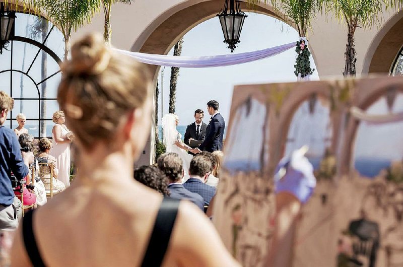 This 2018 photo shows artist Laura Swytak painting during a wedding ceremony at Fess Parker in Santa Barbara, Calif. Some couples are inviting painters to capture a scene or the mood of their big day in a work they can cherish. Having the artist at the reception also adds a special kind of entertainment. 