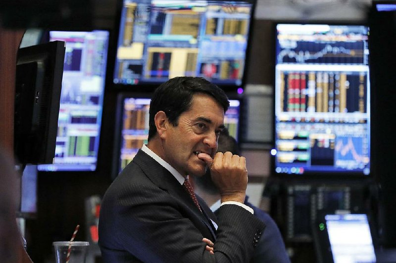 Trader Mark Muller watches Thursday on the floor of the New York Stock Exchange as stocks plummet amid fears that chances for a recession are larger than experts previously thought. 