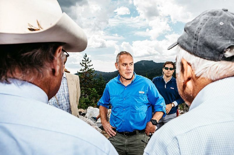 Ryan Zinke visits Rocky Mountain National Park, Colo., in July 2017 as interior secretary. Zinke, who departed his post Wednesday, is facing two inspector general inquiries. 