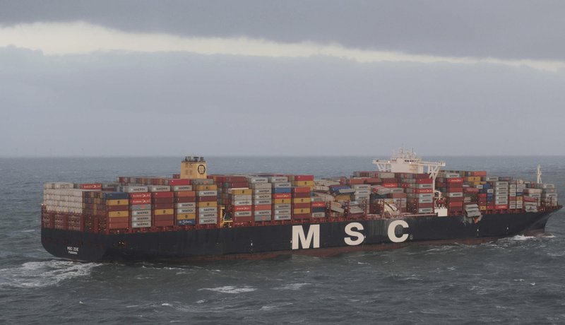 Aerial photo provided by the Central Command for Maritime Emergencies Germany shows container vessel MSC ZOE near the German North Sea island of Borkum Wednesday, Jan. 2, 2019. The Dutch coast guard said that along with light bulbs, toys and flat screens, some of the containers carried closed-off barrels of an organic peroxide, a flammable and highly toxic compound. The container ship is suspected to have lost the cargo during an overnight storm in waters off the coastal border between Germany and the Netherlands. (Central Command for Maritime Emergencies Germany/dpa via AP)