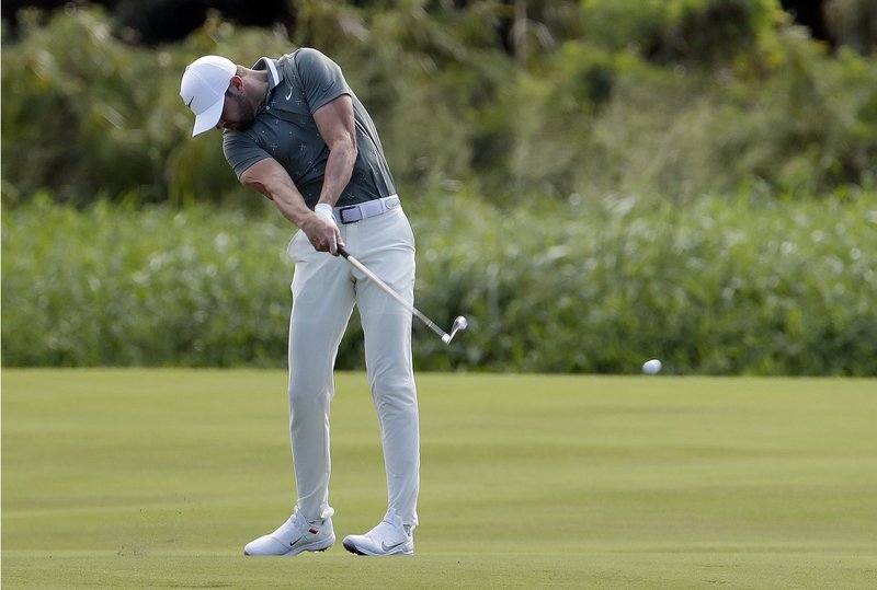 Kevin Tway hits from the 18th fairway during the first round of the Tournament of Champions golf event Thursday, Jan. 3, 2019, at Kapalua Plantation Course in Kapalua, Hawaii. (AP Photo/Matt York)