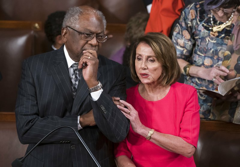 Speaker of the House Nancy Pelosi, D-Calif., talks with House Majority Whip James Clyburn, D-S.C., left, on the opening day of the 116th Congress as the Democrats take the majority from the GOP, at the Capitol in Washington, Thursday, Jan. 3, 2019. (AP Photo/J. Scott Applewhite)
