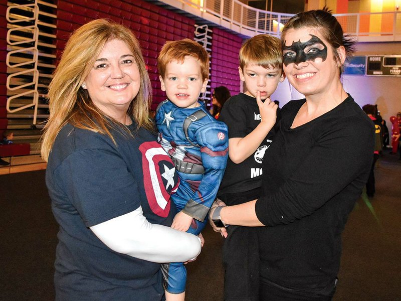 Attending last year’s Mother-Son Superhero Dance is, from left, Pamela Harbour, Jacob Milam, Gavin Milam and Gina Milam. Gina said her sons really enjoyed dressing up as their favorite superheroes and getting to meet Batman and Wonder Woman. This year’s dance is scheduled for Jan. 18.
