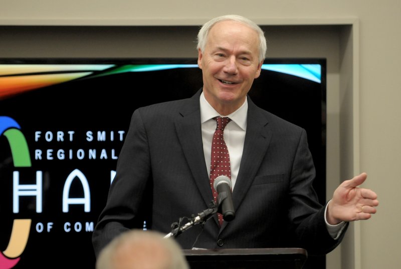 FILE — In this file photo, Governor Asa Hutchinson speaks Wednesday, January 2, 2019 before his announcement of Keith Gibson as the incoming Arkansas Highway Commissioner at the Fort Smith Regional Chamber of Commerce in Fort Smith. 