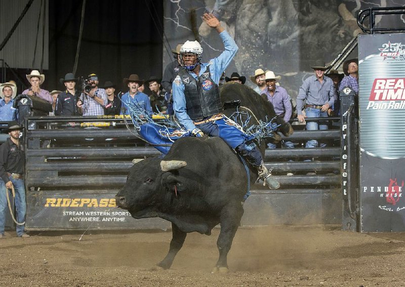 Bull rider Ezekiel Mitchell rides Last Chance during an event in Colorado Springs, Colo., in October. Mitchell played football and ran track because he didn’t have the background or financial means to learn how to ride a bull. So when it came to how to learn, he did what many teenagers do these days: He watched YouTube.