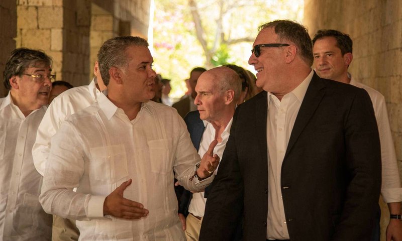 In this photo released by the Colombia's Presidency U.S. Secretary of State Mike Pompeo, right, and Colombia's President Ivan Duque talk during a meeting at the Presidential Guest House in Cartagena, Colombia, Wednesday, Jan. 2, 2019. (Nicolas Galeano/Colombia's Presidency via AP)