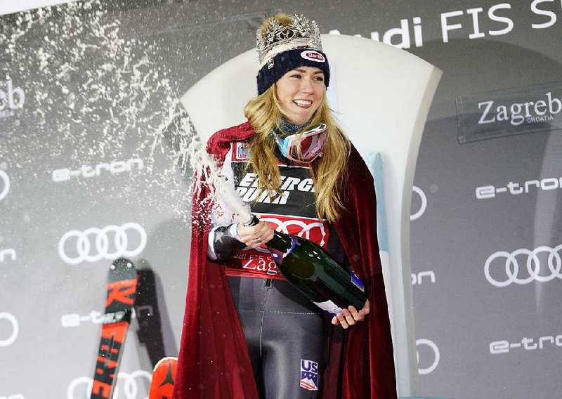 United States' Mikaela Shiffrin celebrates on the podium as she wears the crown of Snow Queen after winning an alpine ski, women's World Cup slalom, in Zagreb, Croatia, Saturday, Jan. 5, 2019.