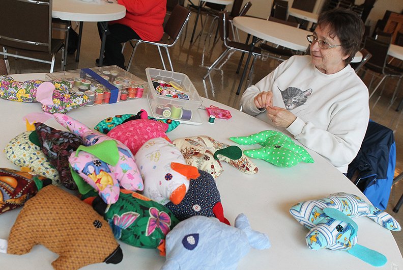 The Sentinel-Record/Richard Rasmussen ER TOYS: Women's Welcome Club member Barbara Henry sews a stuffed animal during the club's monthly meeting Wednesday at Westminster Presbyterian Church Wednesday.