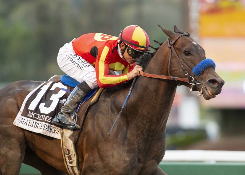 In a photo provided by Benoit Photo, McKinzie and jockey Mike Smith win the Grade I, $300,000 Malibu Stakes horse race Wednesday, Dec. 26, 2018, at Santa Anita in Arcadia, Calif. (Benoit Photo via AP)